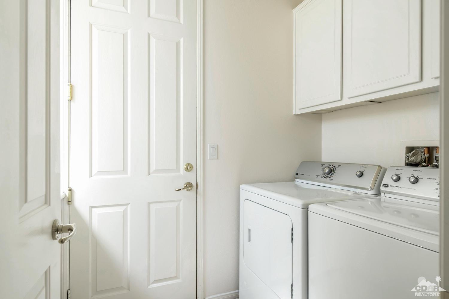 36 Shoreline Drive Rancho Mirage, CA 92270 - Photo 18 of 38 a utility room with dryer and washer