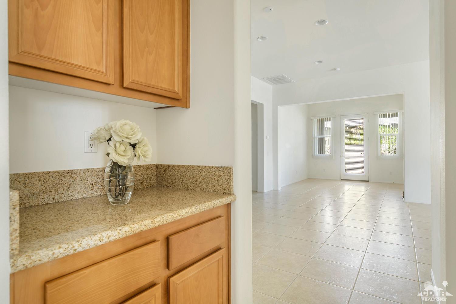 36 Shoreline Drive Rancho Mirage, CA 92270 - Photo 19 of 38 a kitchen with stainless steel appliances granite countertop a sink and cabinets
