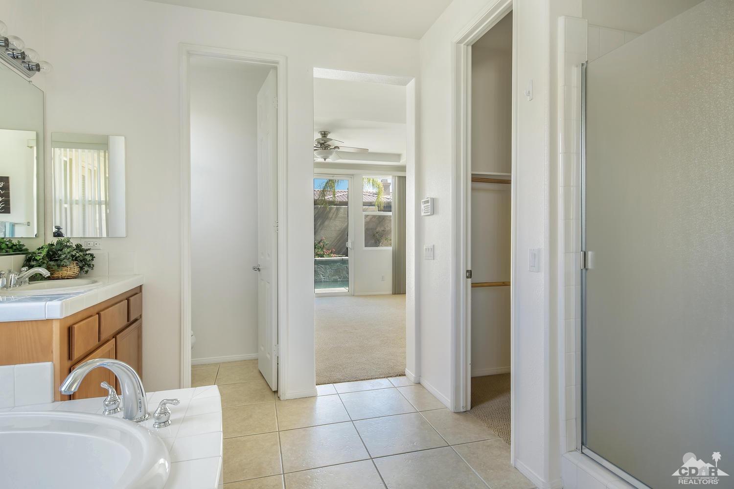 36 Shoreline Drive Rancho Mirage, CA 92270 - Photo 22 of 38 a bathroom with a bathtub and shower