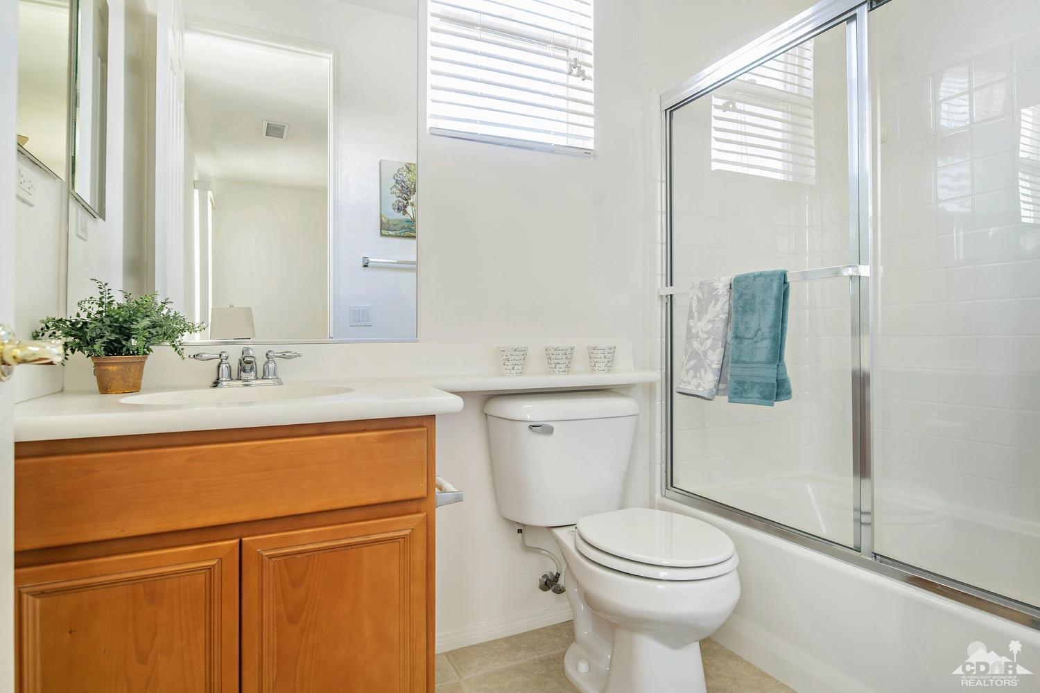 36 Shoreline Drive Rancho Mirage, CA 92270 - Photo 23 of 38 a bathroom with a sink toilet and shower