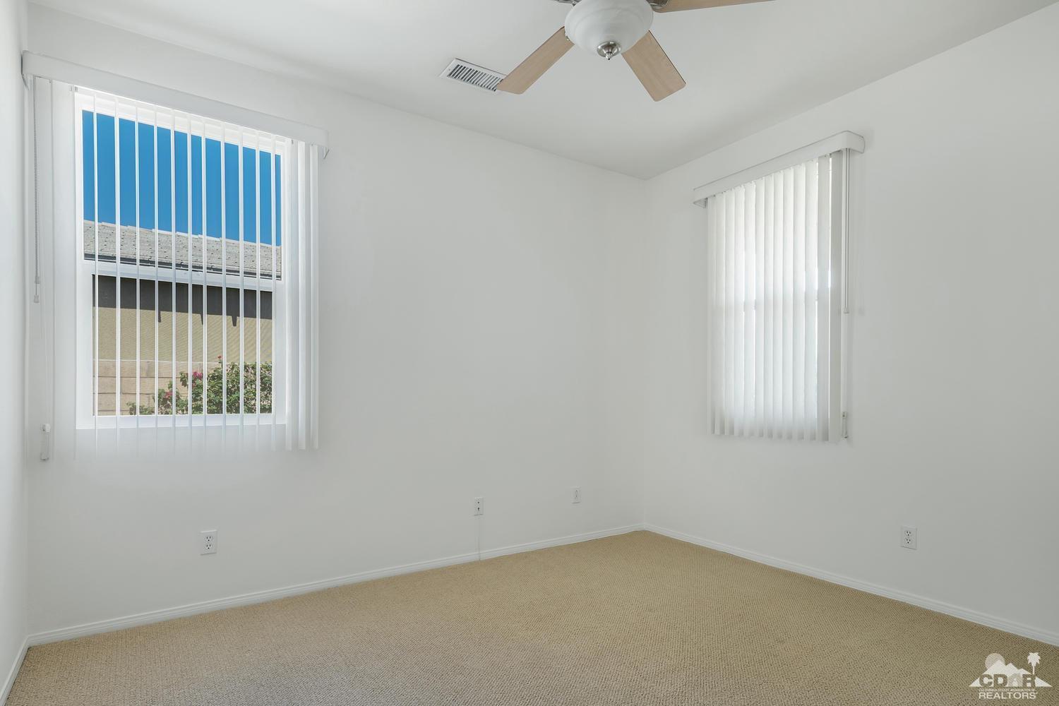 36 Shoreline Drive Rancho Mirage, CA 92270 - Photo 24 of 38 an empty room with windows