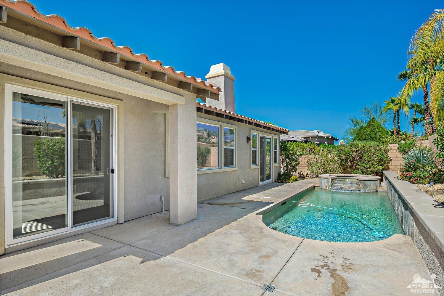 36 Shoreline Drive Rancho Mirage, CA 92270 - Photo 26 of 38 front view of a house with a garden