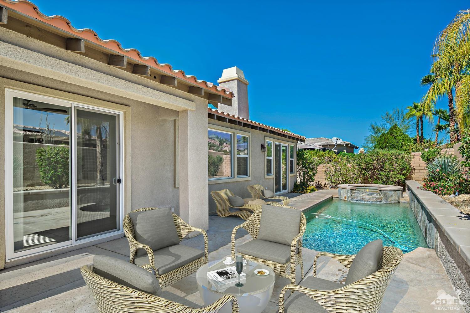 36 Shoreline Drive Rancho Mirage, CA 92270 - Photo 27 of 38 a view of a patio with couches chairs and potted plants