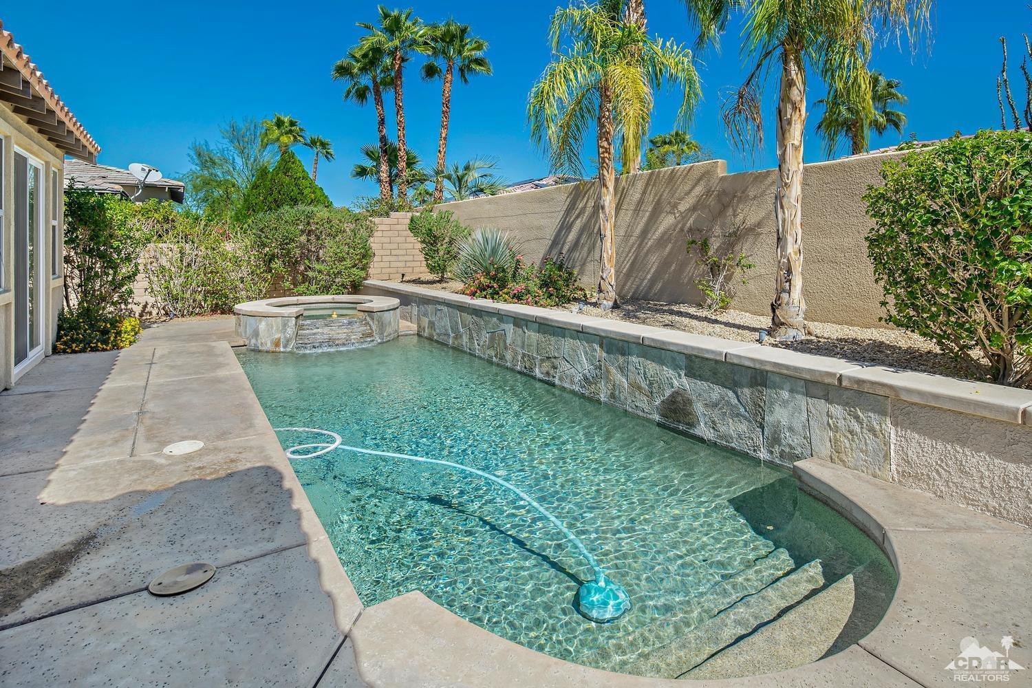 36 Shoreline Drive Rancho Mirage, CA 92270 - Photo 28 of 38 a view of a swimming pool with a patio