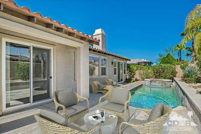 36 Shoreline Drive Rancho Mirage, CA 92270 - Photo 37 of 38 a view of a patio with couches table and chairs and potted plants