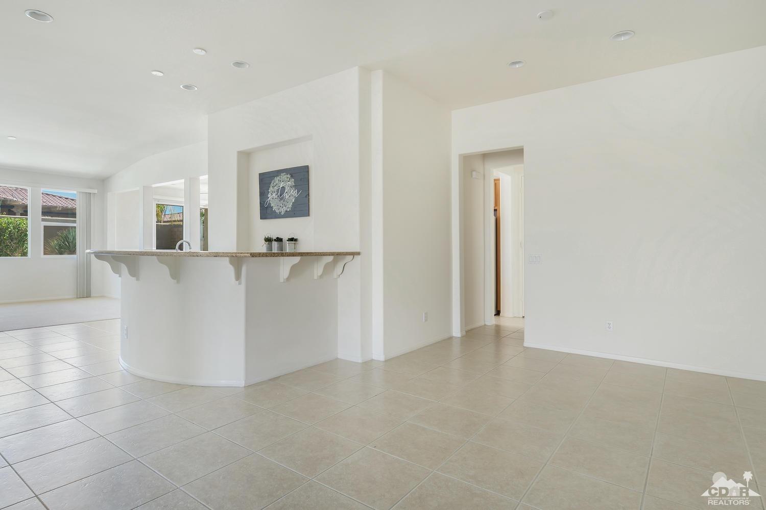 36 Shoreline Drive Rancho Mirage, CA 92270 - Photo 8 of 38 an empty room with windows and cabinet