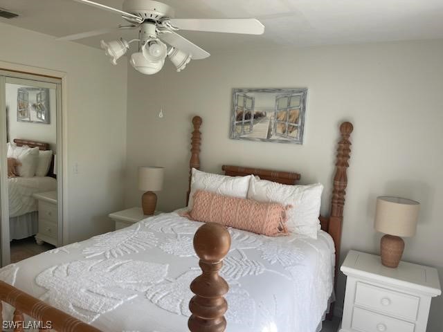 20918 Country Barn Drive Estero, FL 33928 - Photo 20 of 48 a bedroom with a bed and a chandelier