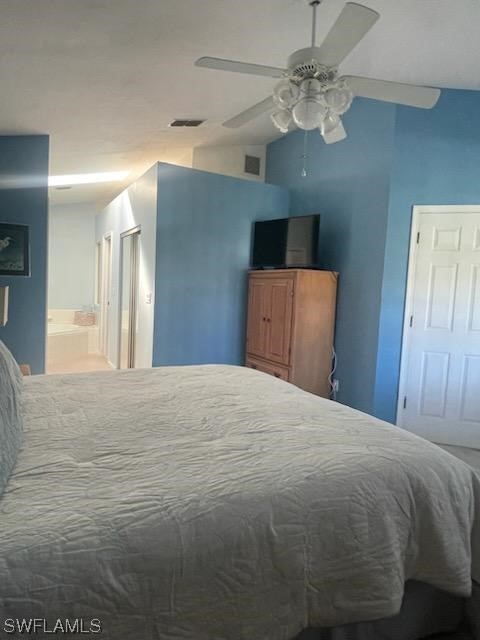20918 Country Barn Drive Estero, FL 33928 - Photo 28 of 48 a bedroom with a bed and a chandelier