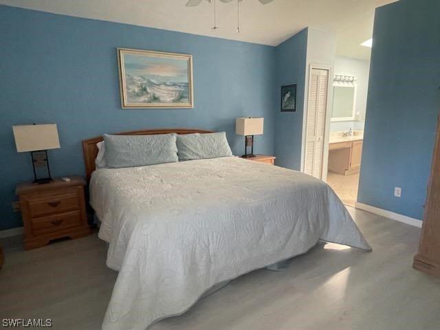 20918 Country Barn Drive Estero, FL 33928 - Photo 29 of 48 a large bed sitting in a bedroom next to a window