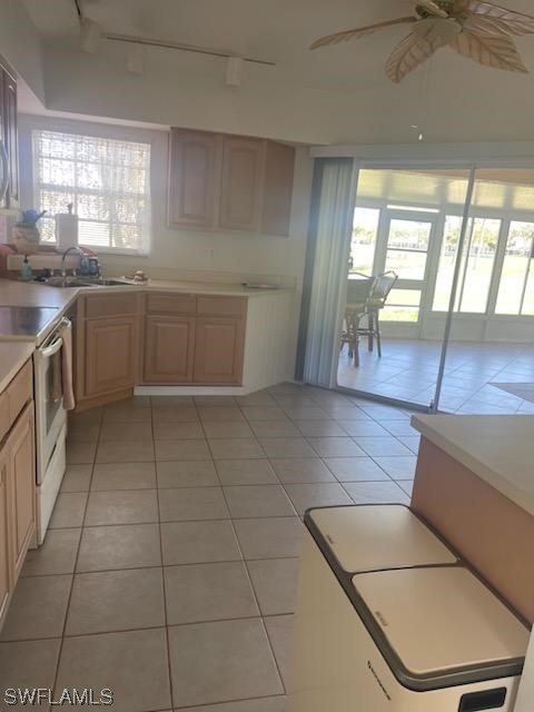20918 Country Barn Drive Estero, FL 33928 - Photo 39 of 48 a kitchen with a sink a counter top space cabinets and stainless steel appliances