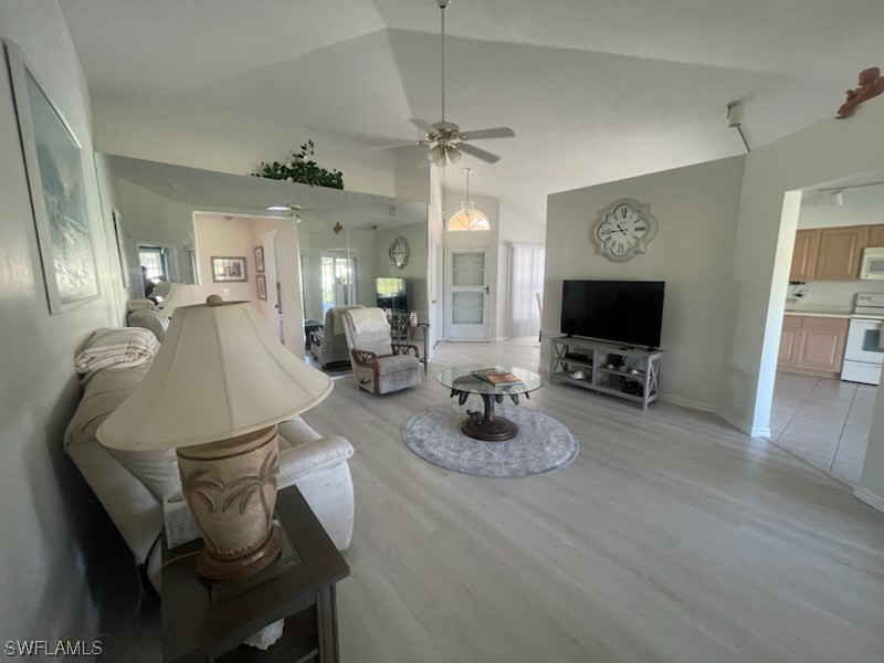 20918 Country Barn Drive Estero, FL 33928 - Photo 45 of 48 a living room with furniture and a flat screen tv