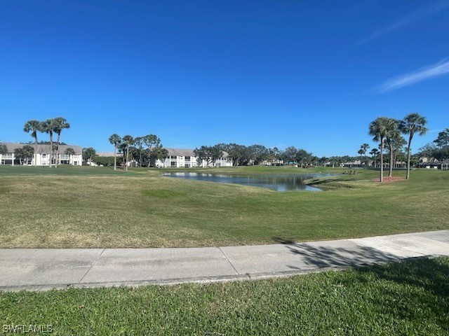 20918 Country Barn Drive Estero, FL 33928 - Photo 7 of 48 a view of a lake with a building in the background