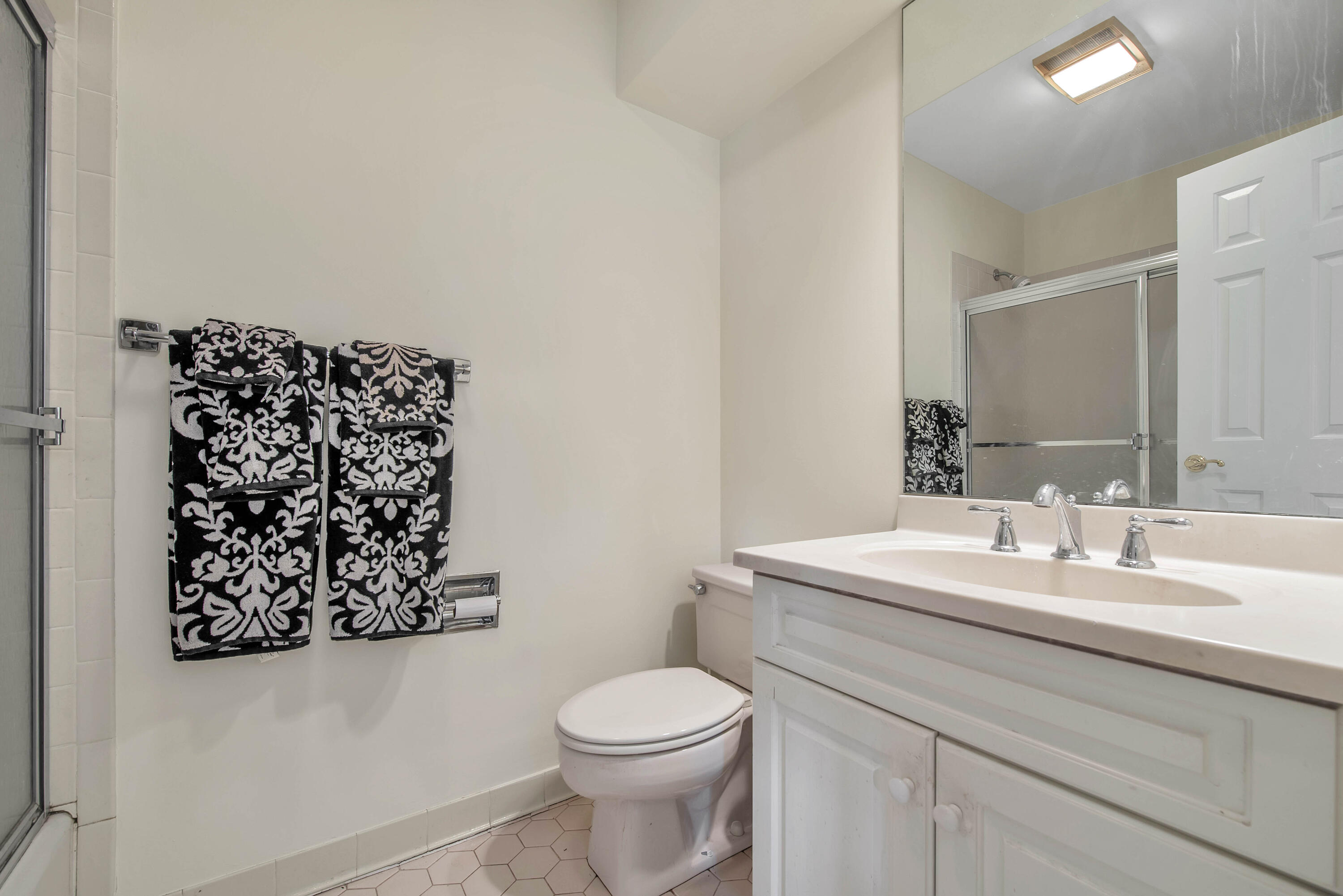 Undisclosed Address New Canaan, CT 06840 - Photo 25 of 38 a bathroom with a sink mirror vanity and toilet