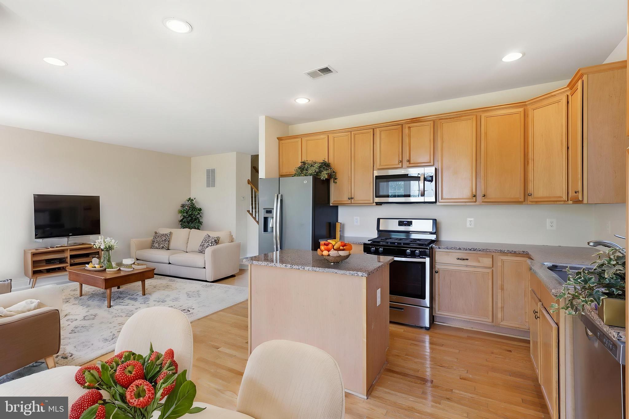 19617 Edgemont Square Ashburn, VA 20147 - Photo 18 of 65 a living room with stainless steel appliances furniture stove and a view of kitchen