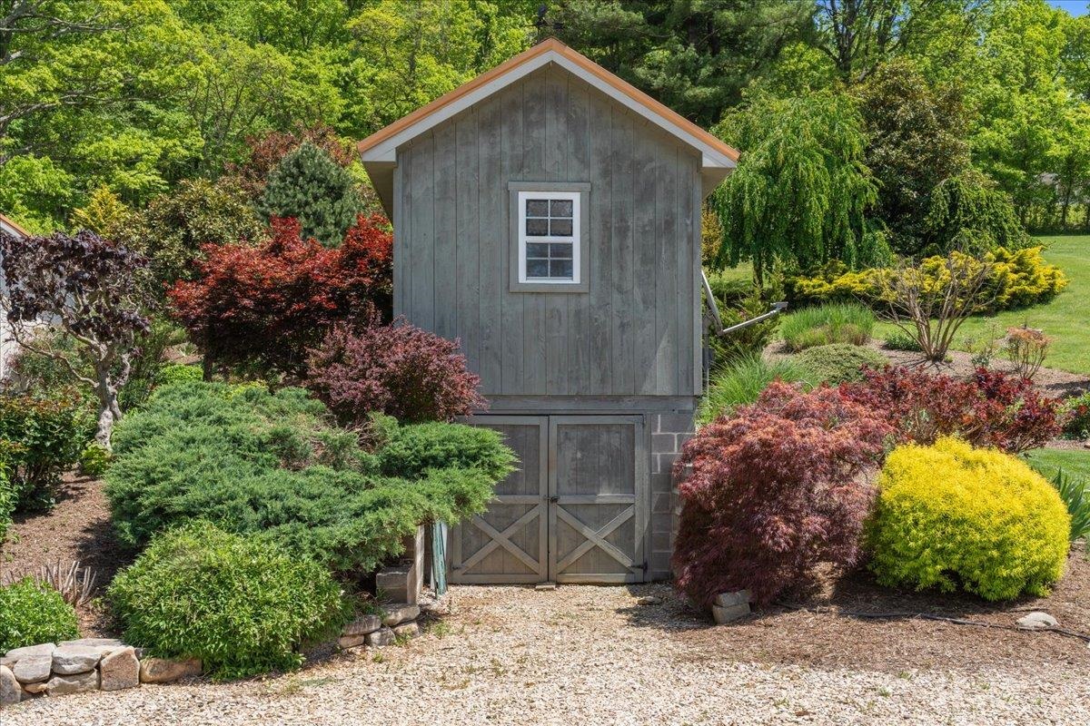 650 Sandy Bottom Road Elkton, VA 22827 - Photo 14 of 75 a view of a backyard with plants and large trees