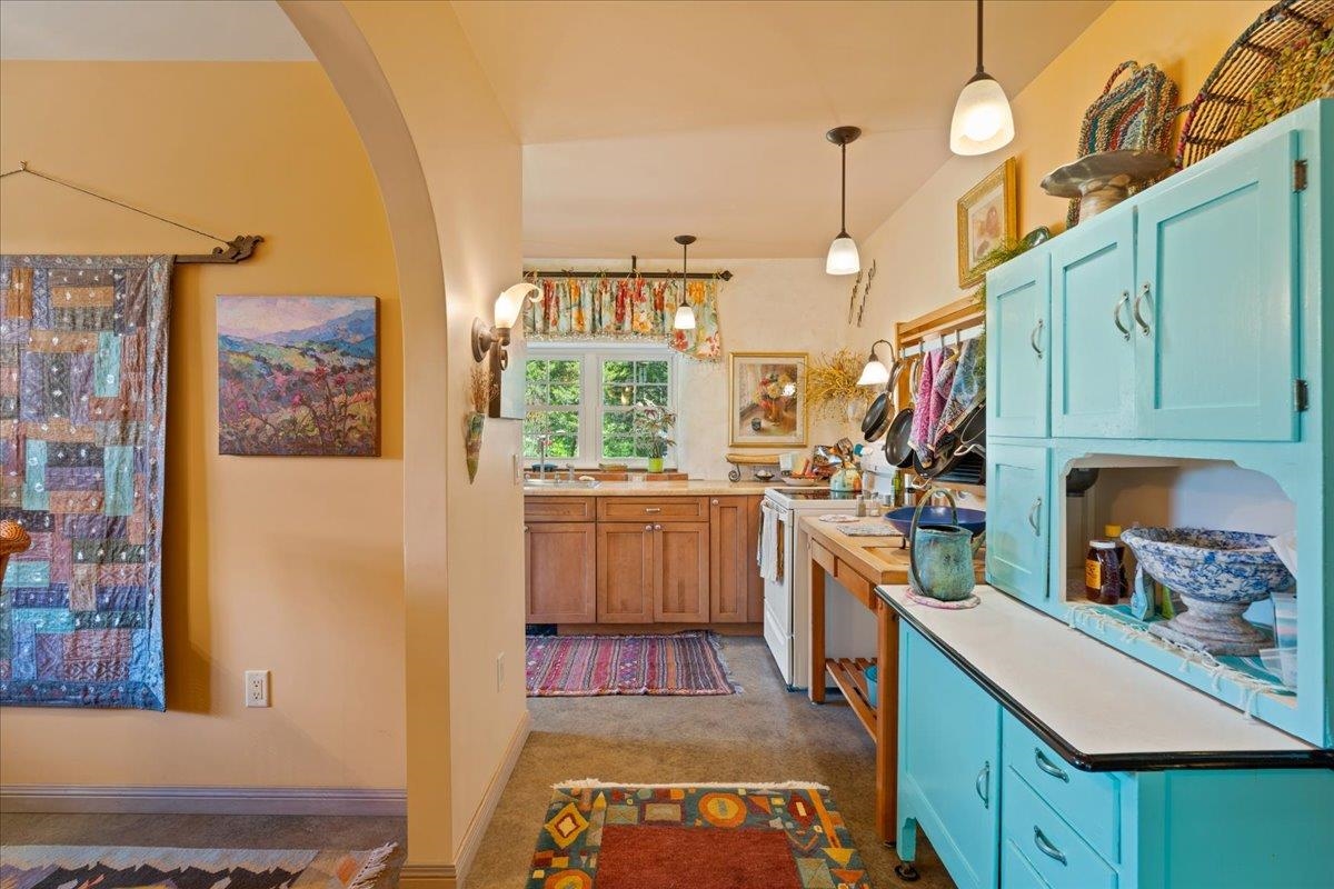 650 Sandy Bottom Road Elkton, VA 22827 - Photo 25 of 75 a kitchen that has a lot of cabinets a sink and a stove in it