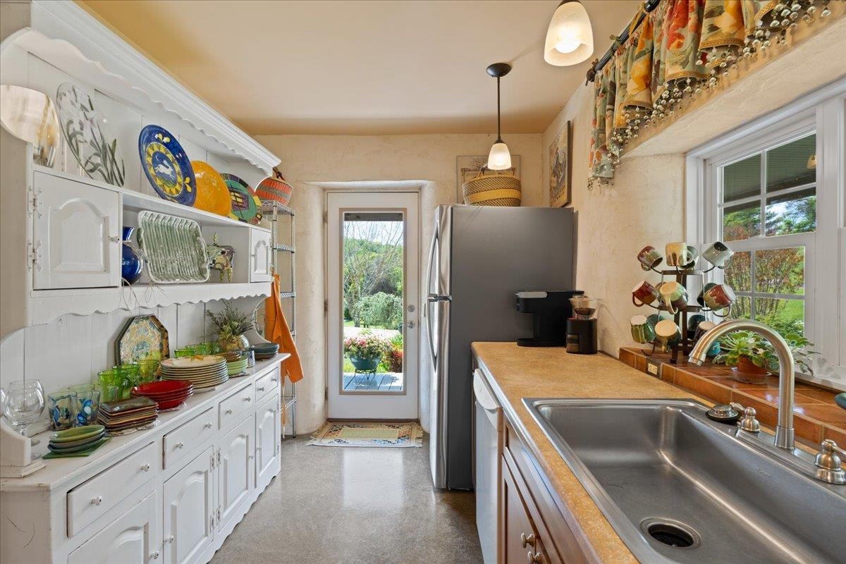650 Sandy Bottom Road Elkton, VA 22827 - Photo 26 of 75 a kitchen with stainless steel appliances a sink a stove and a window