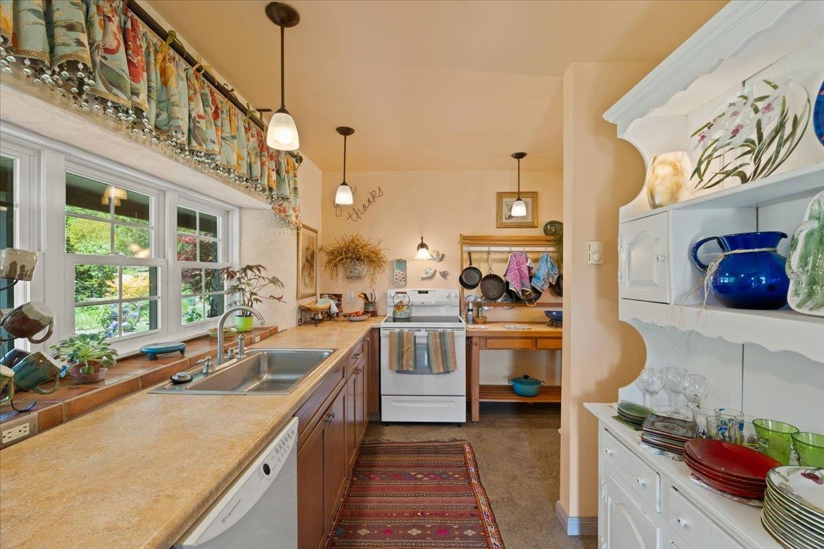 650 Sandy Bottom Road Elkton, VA 22827 - Photo 27 of 75 a kitchen with kitchen island granite countertop lots of counter top space and stainless steel appliances