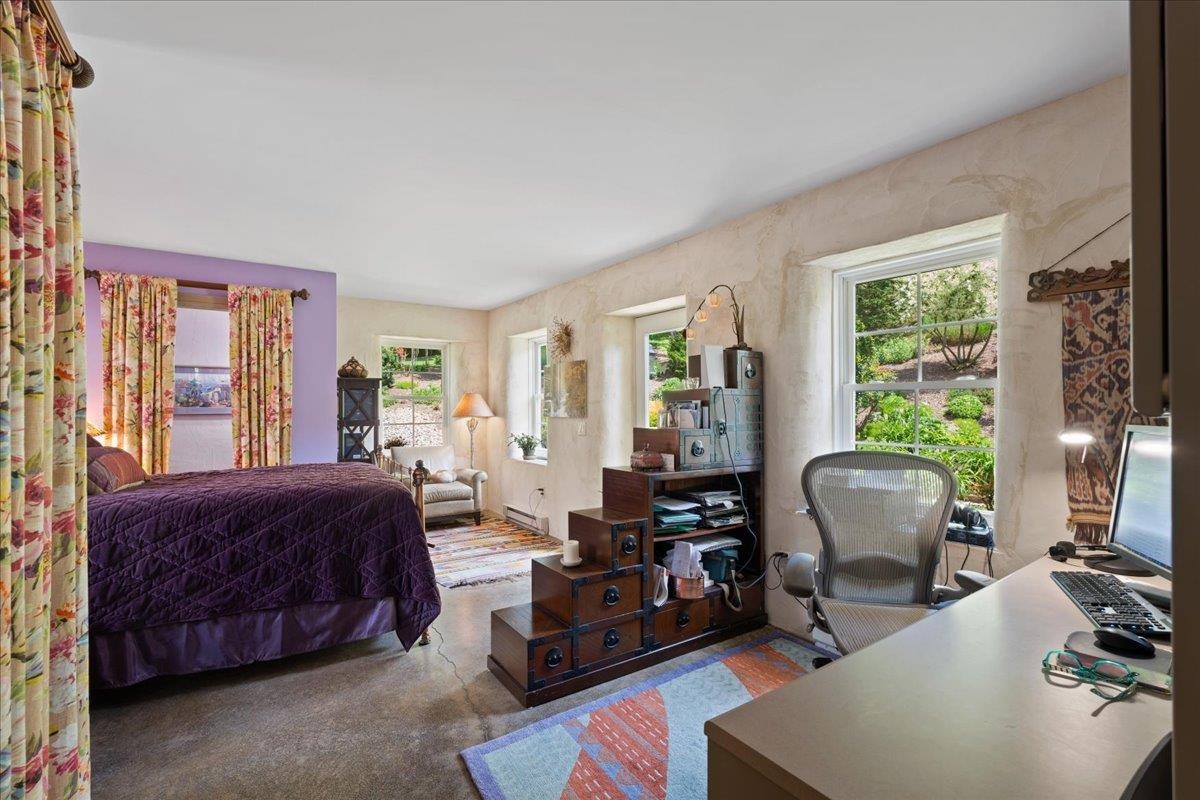 650 Sandy Bottom Road Elkton, VA 22827 - Photo 37 of 75 a bedroom with a bed and wooden floor