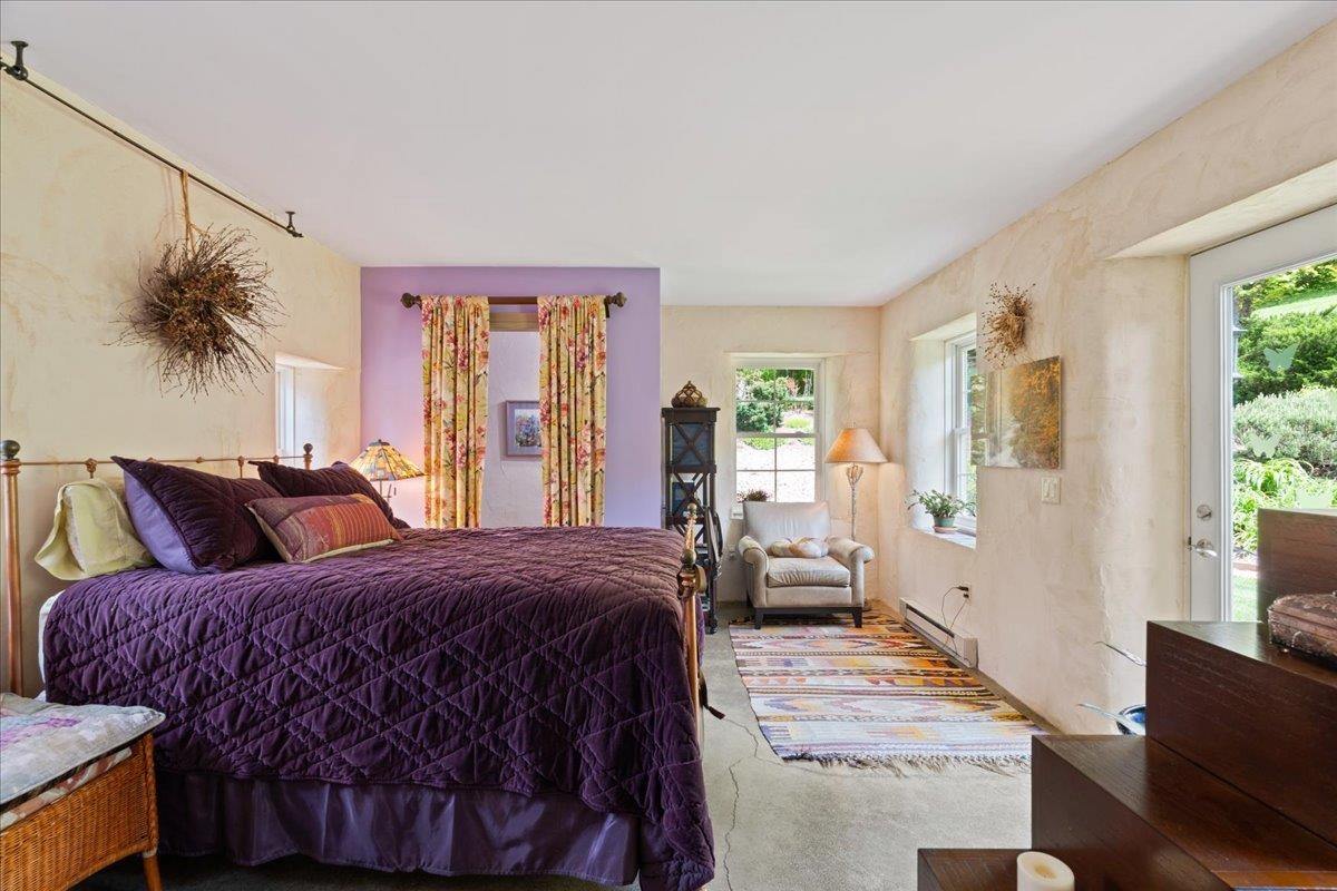 650 Sandy Bottom Road Elkton, VA 22827 - Photo 38 of 75 a bedroom with a large bed and wooden floor