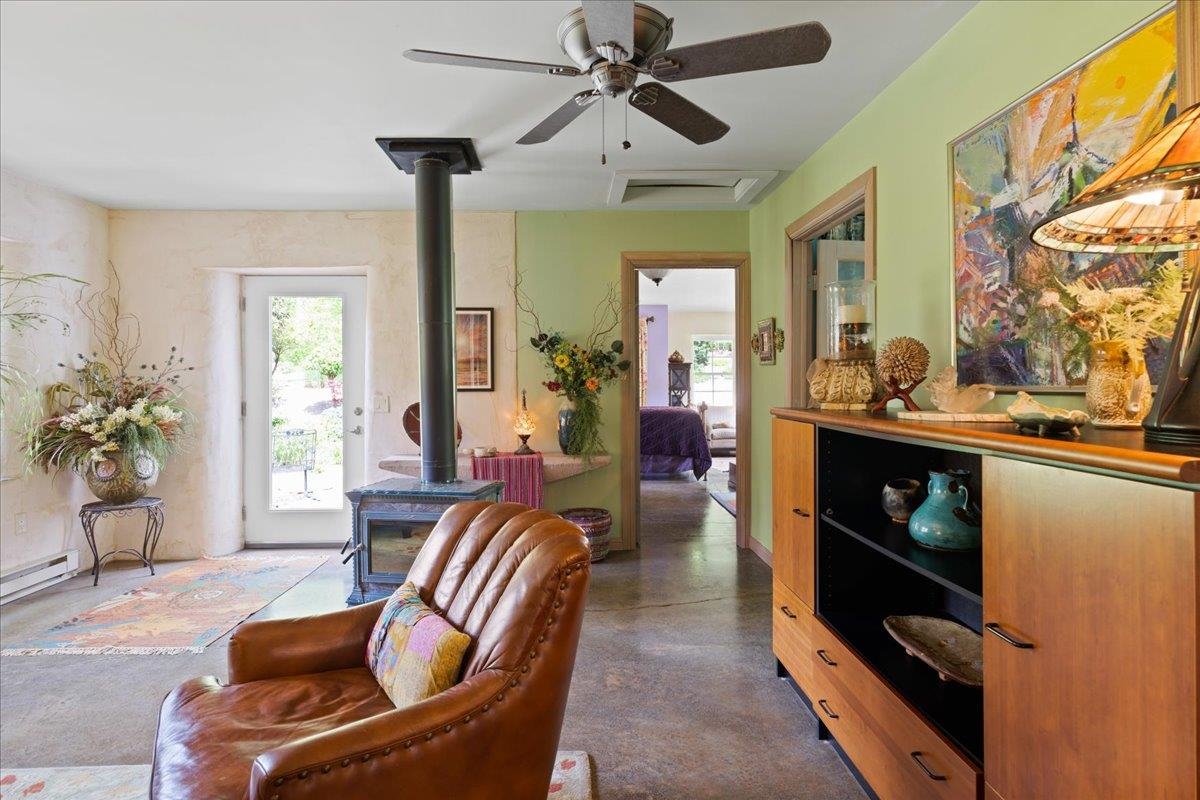 650 Sandy Bottom Road Elkton, VA 22827 - Photo 43 of 75 a living room with furniture a chandelier and a window
