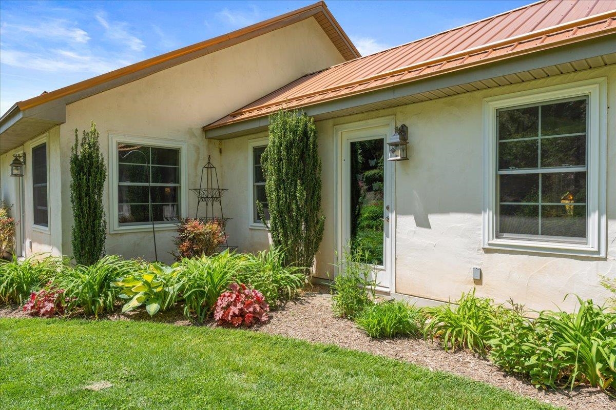 650 Sandy Bottom Road Elkton, VA 22827 - Photo 52 of 75 a front view of a house with a garden