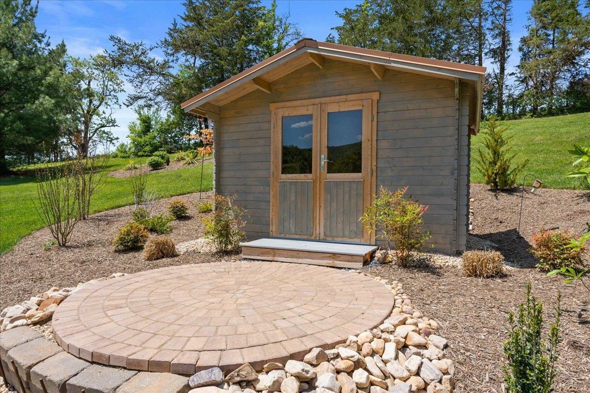 650 Sandy Bottom Road Elkton, VA 22827 - Photo 66 of 75 a backyard of a house with table and chairs