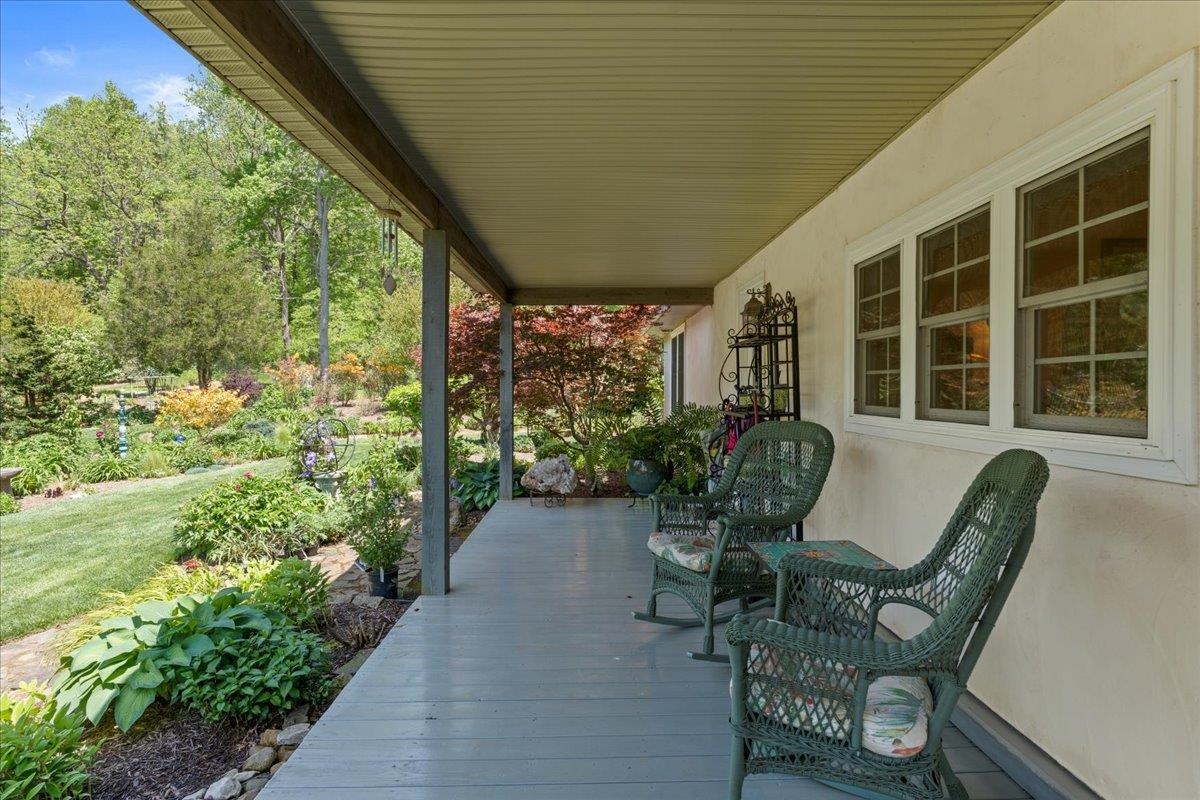 650 Sandy Bottom Road Elkton, VA 22827 - Photo 8 of 75 a view of a chair and table in backyard of the house