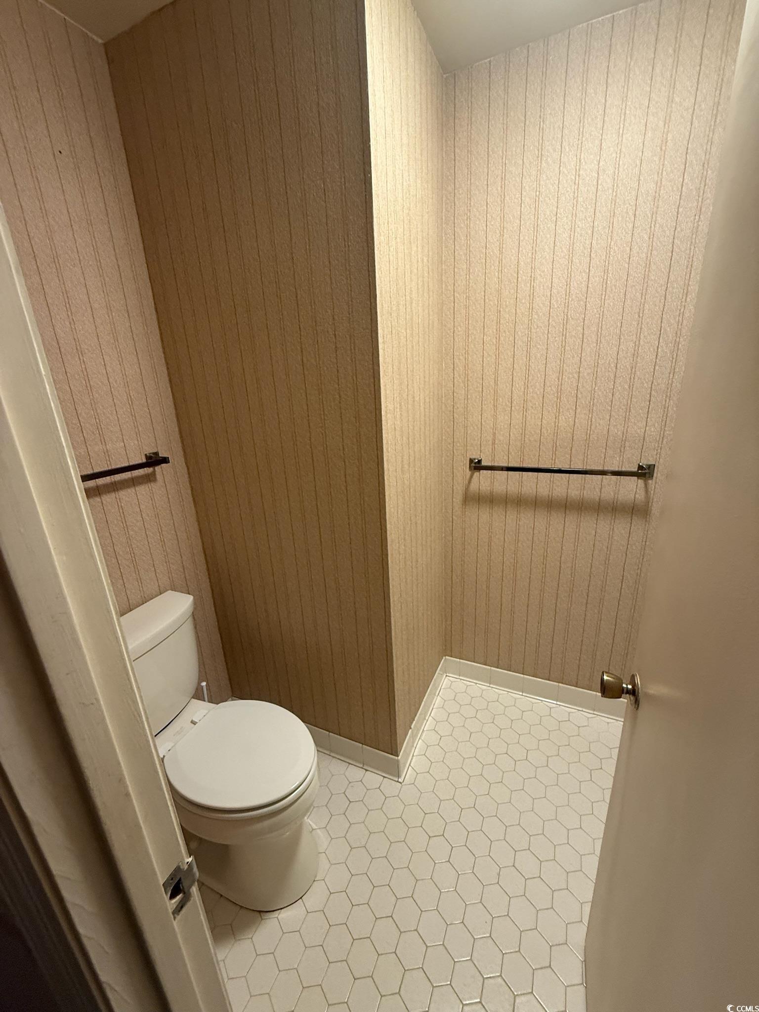 80 Wedgefield Village Road, Unit 46 Georgetown, SC 29440 - Photo 13 of 16 Bathroom with light tile patterned floors and wood