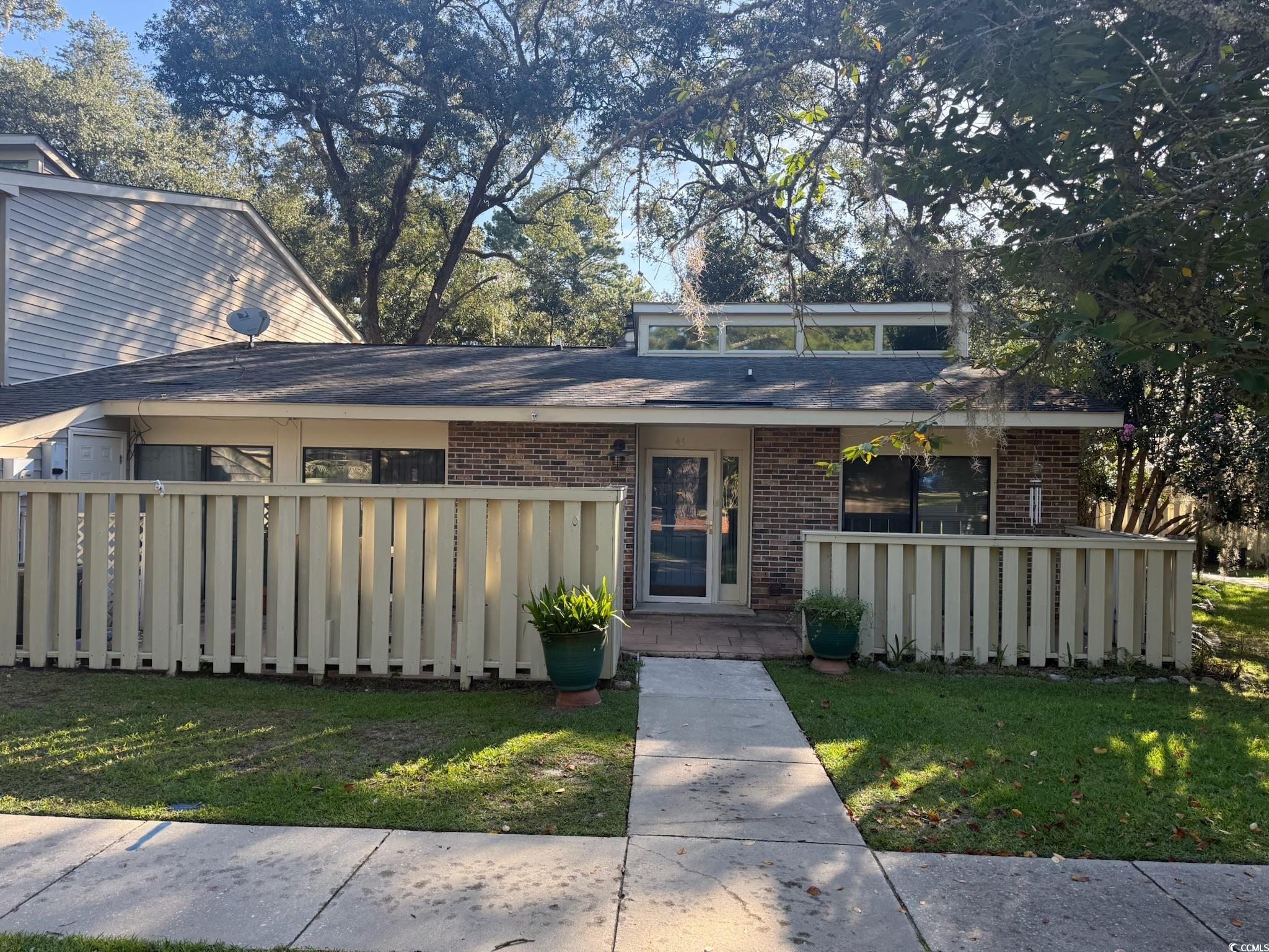 80 Wedgefield Village Road, Unit 46 Georgetown, SC 29440 - Photo 14 of 19 Mid-century modern home with brick siding and roof with shingles