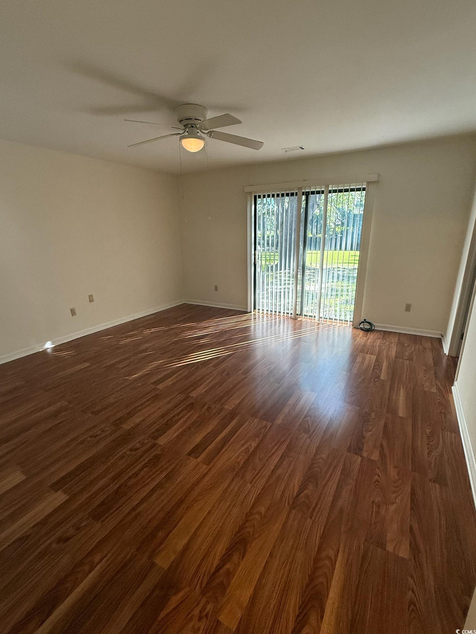 80 Wedgefield Village Road, Unit 46 Georgetown, SC 29440 - Photo 5 of 16 Unfurnished room with dark wood-type flooring and