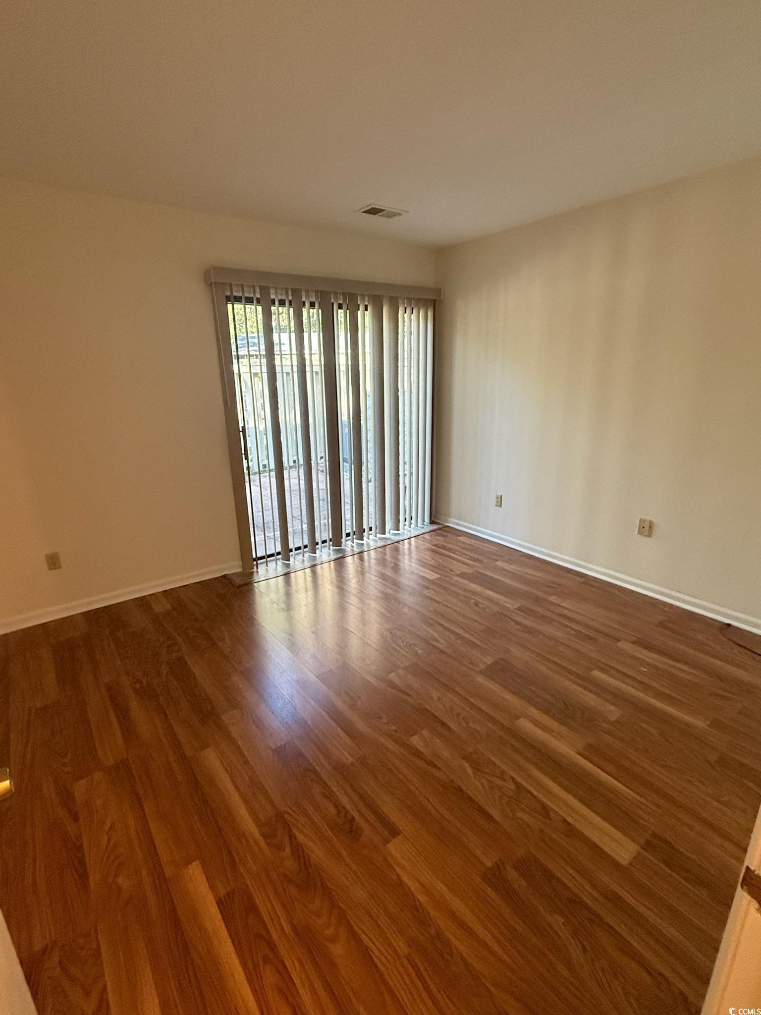 80 Wedgefield Village Road, Unit 46 Georgetown, SC 29440 - Photo 10 of 19 Spare room featuring wood finished floors and baseboards