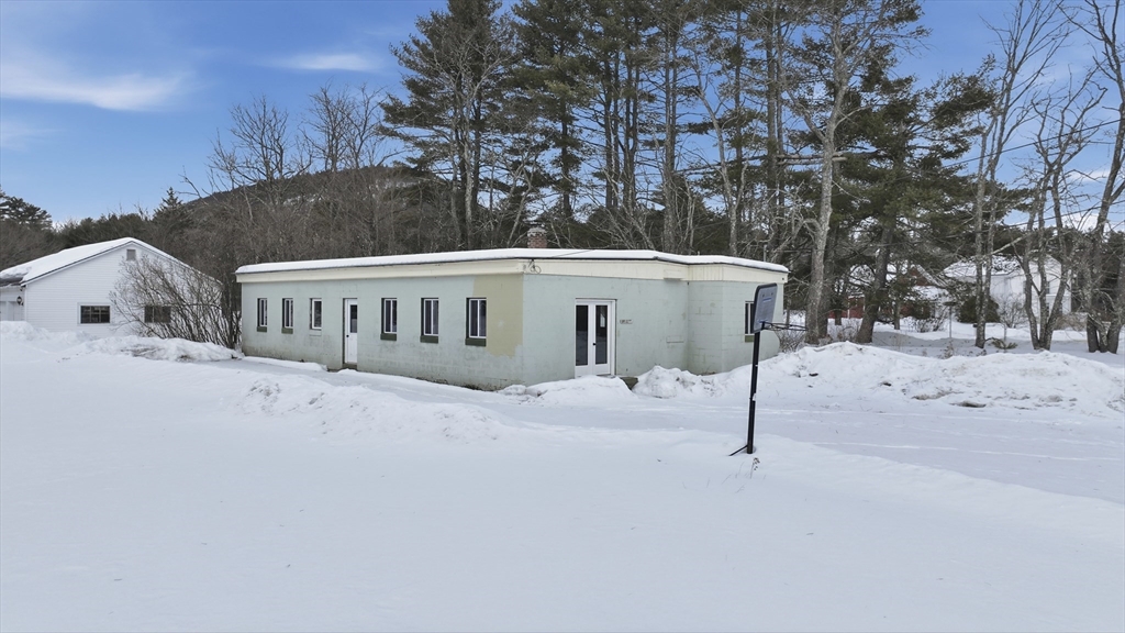 109 Royalston Road Orange, MA 01364 - Photo 1 of 27 a view of house with a snow in the background