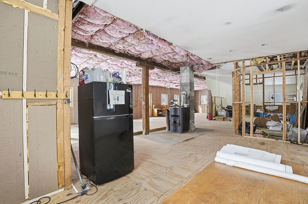 109 Royalston Road Orange, MA 01364 - Photo 12 of 27 a kitchen with stainless steel appliances granite countertop a refrigerator and a sink