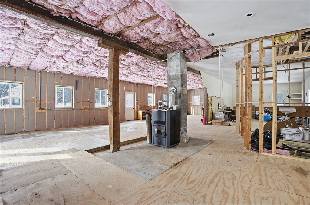 109 Royalston Road Orange, MA 01364 - Photo 13 of 27 a view of a porch with furniture and a refrigerator