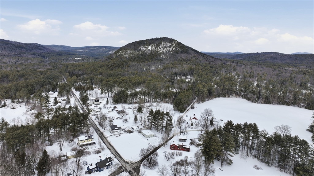 109 Royalston Road Orange, MA 01364 - Photo 22 of 27 a view of a mountain in the distance in a field