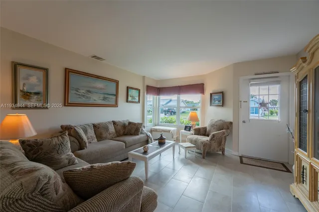 a living room with furniture and a window