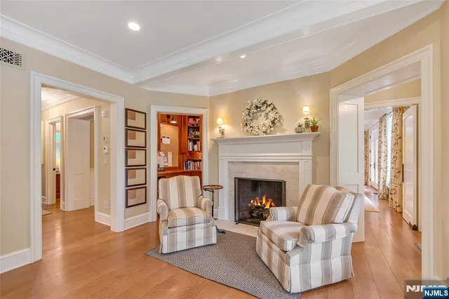 a bathroom with a granite countertop sink toilet and mirror