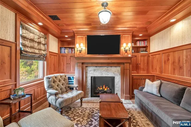 a bedroom with a bed and a large window with outer view