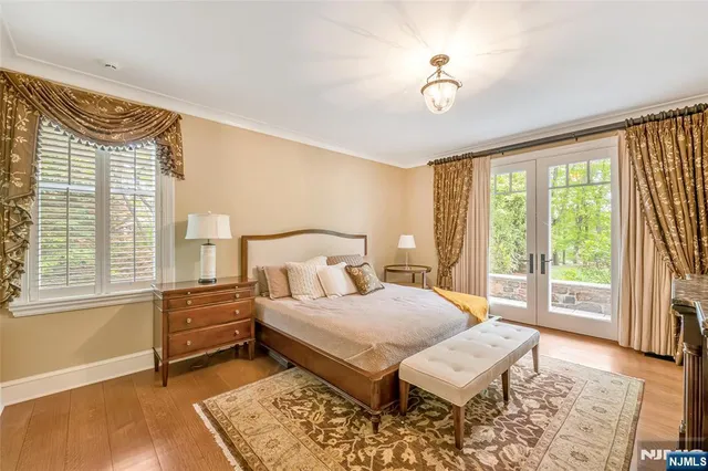 a bathroom with a double vanity sink mirror and shower