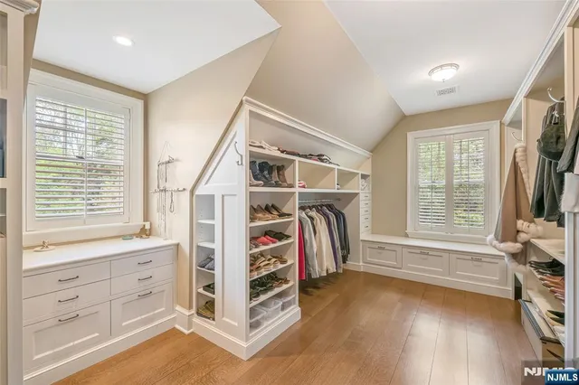 a kitchen with stainless steel appliances a stove a sink and a window