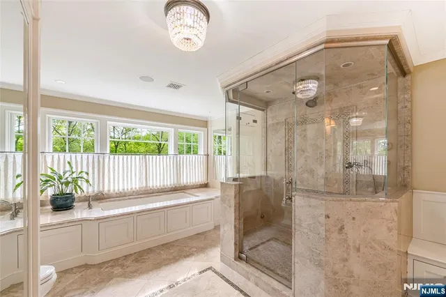 a kitchen with a window and potted plant