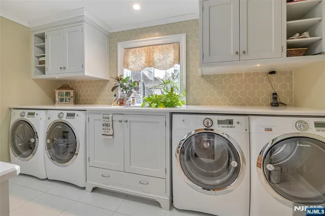 a view of a hallway with wooden floor windows and a living room