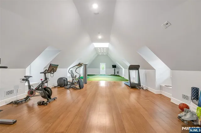 a view of entryway with wooden floor and stairs