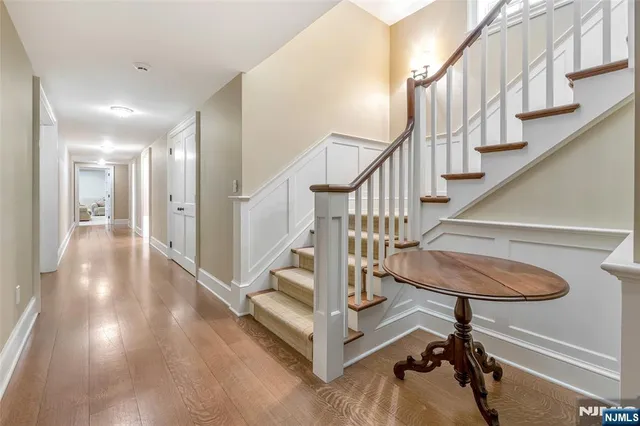 a living room with furniture a table and gym equipment