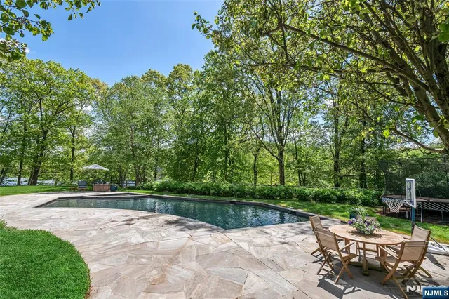 a view of a patio with a table and chairs