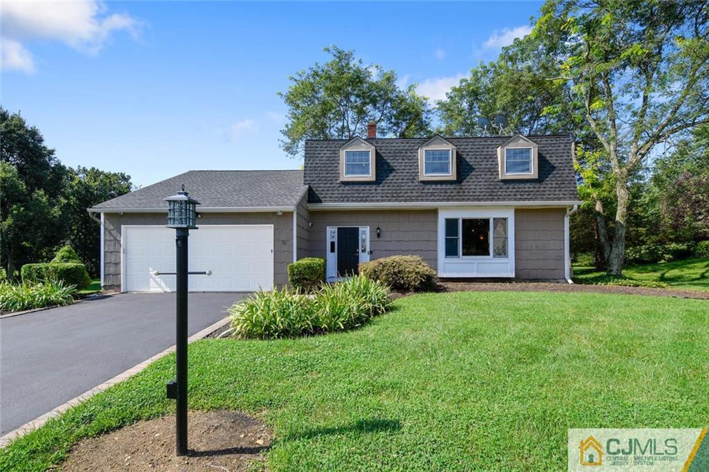 124 Fairfield Road Princeton, NJ 08540 - Photo 1 of 24 a front view of a house with a garden and plants