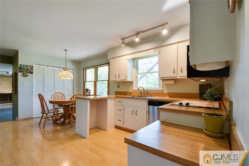 124 Fairfield Road Princeton, NJ 08540 - Photo 11 of 24 a kitchen with a dining table chairs and refrigerator