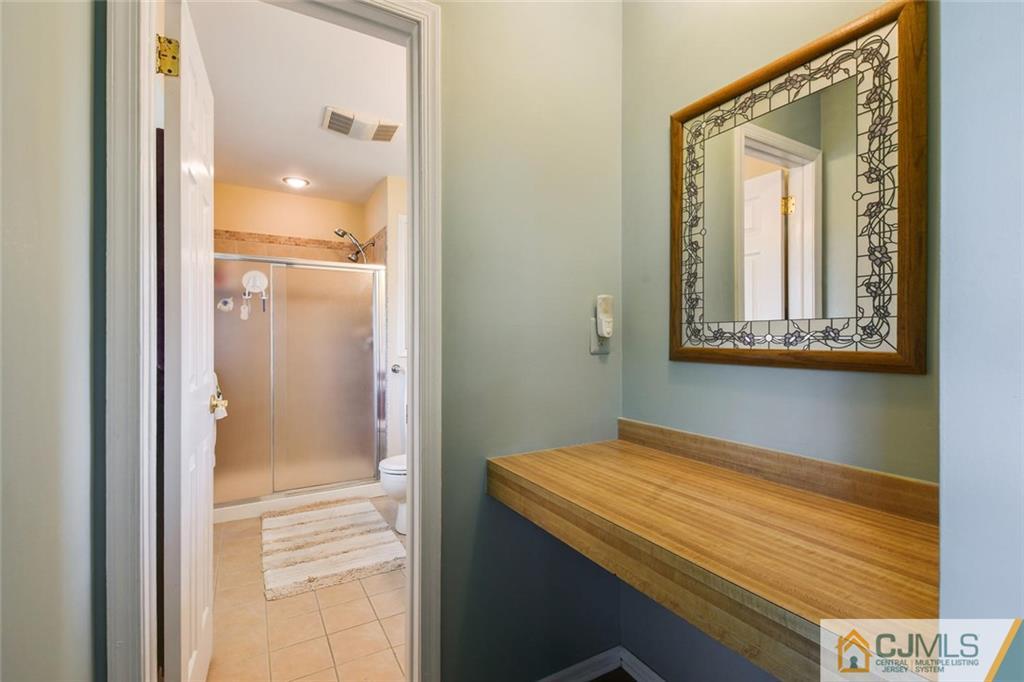 124 Fairfield Road Princeton, NJ 08540 - Photo 15 of 24 a bathroom with a sink and a mirror