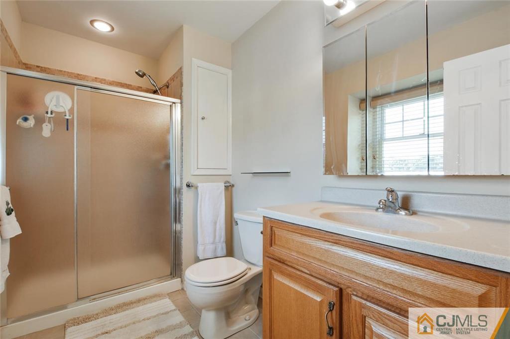 124 Fairfield Road Princeton, NJ 08540 - Photo 16 of 24 a bathroom with a sink a toilet and shower